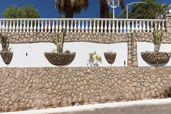 Mediterranean stone wall with cactus — Stock Photo, Image