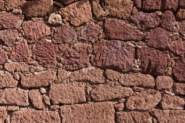 Háttér piros természetes kő-fal — Stock Fotó