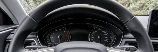 Modern black car instrument panel