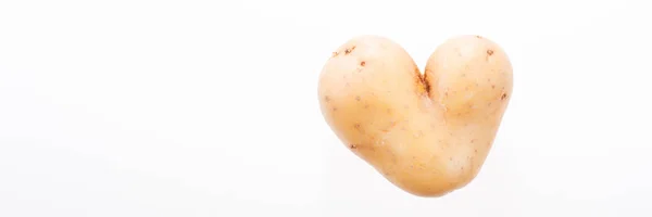 Pomme de terre naturellement en forme de coeur sur blanc — Photo