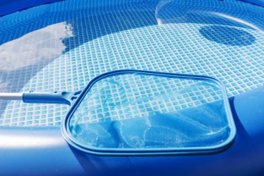 Cleaning and maintenance swimming pool with cleaning net clipart