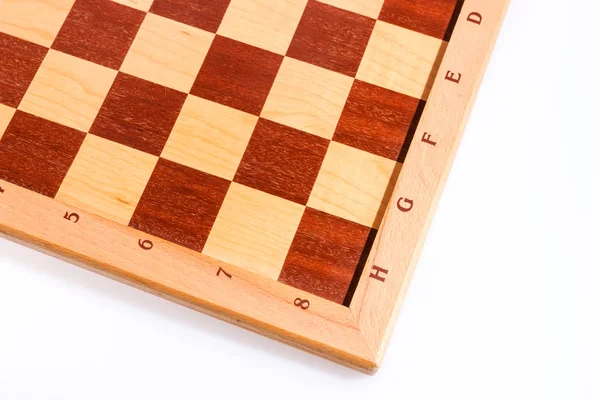 Темные и яркие квадраты деревянной шахматной доски — стоковое фото