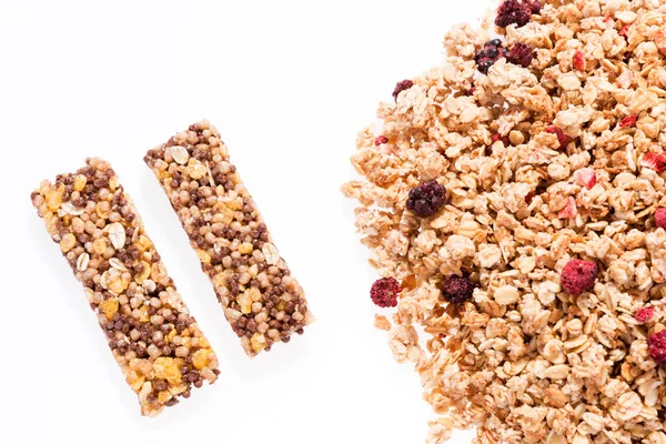 Two healthy granola bar and pile of muesli — Stock Photo, Image