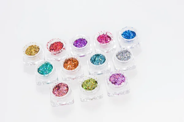 Kleurrijke glitters in transparant glas — Stockfoto