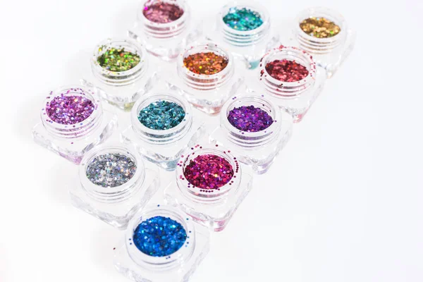 Colorful glitters in transparent jars — Stock Photo, Image