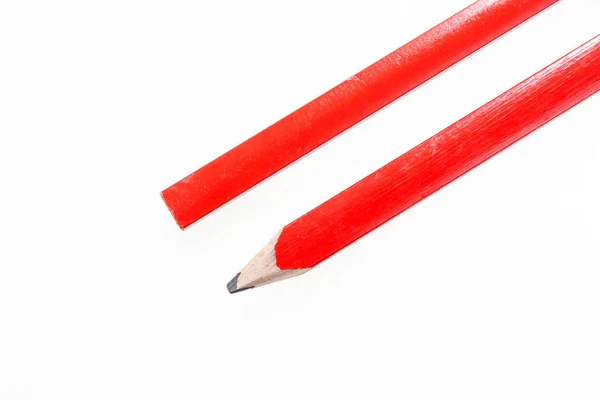 Two red construction pencils isolated on white — Stock Photo, Image