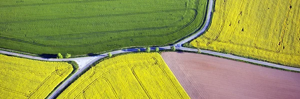 Fields and roads from above. Panoramic aerial view