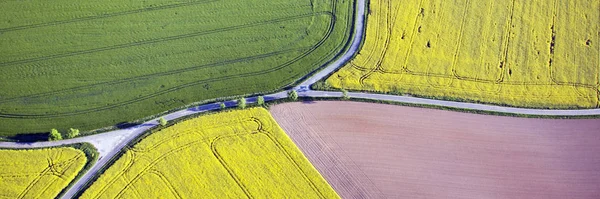 Fields and roads from above. Panoramic aerial view