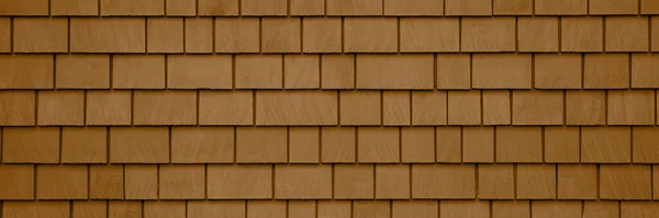 Background of brown wood shingles. Texture wooden roof