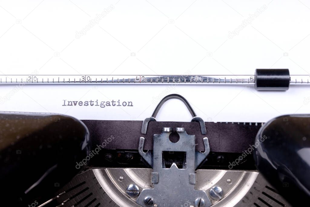 Word Investigation typed on retro black typewriter