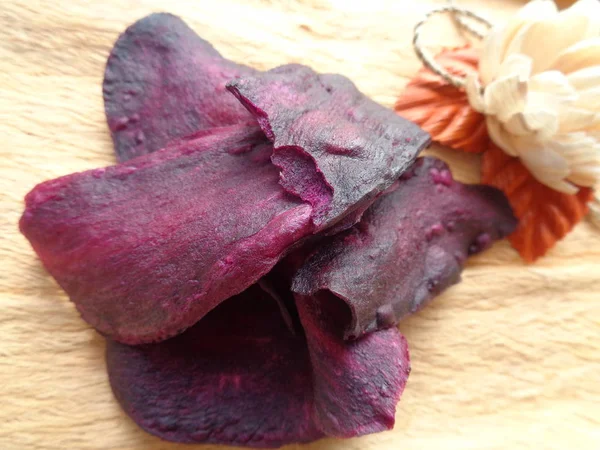 sweat purple potatoes crispy chips. indonesian traditional snack made of sweat potato. really sweat and tasty