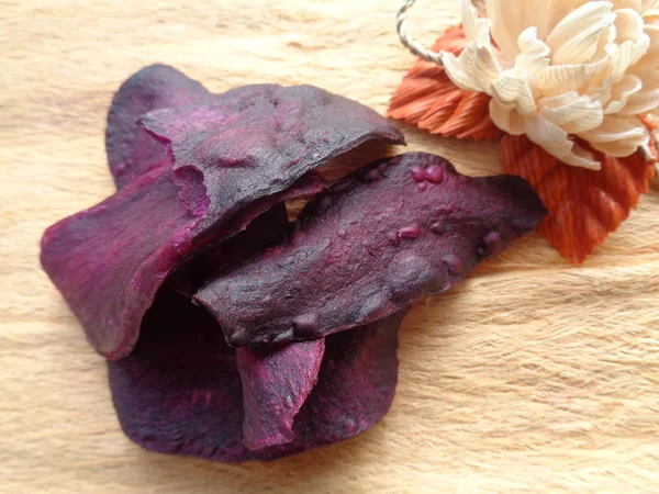 sweat purple potatoes crispy chips. indonesian traditional snack made of sweat potato. really sweat and tasty