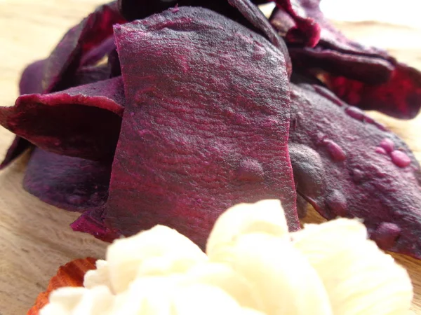 sweat purple potatoes crispy chips. indonesian traditional snack made of sweat potato. really sweat and tasty