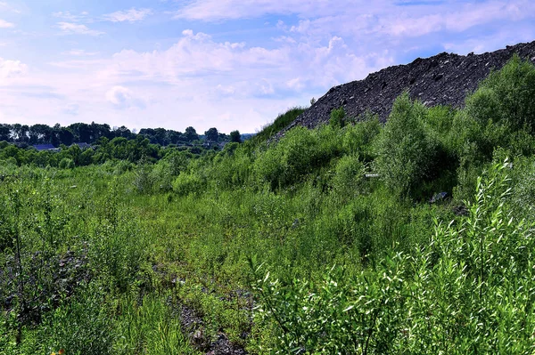 Production area with road and rocks — Stock Photo, Image