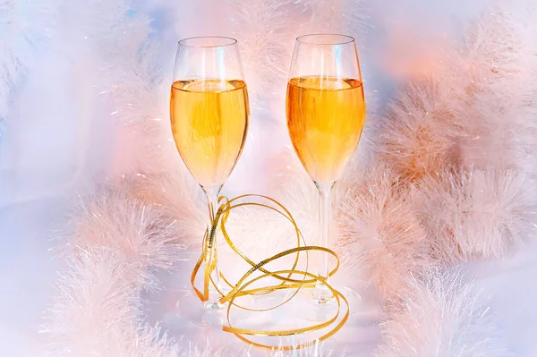 Two glasses of wine and tinsel. Holiday concept. — Stock Photo, Image