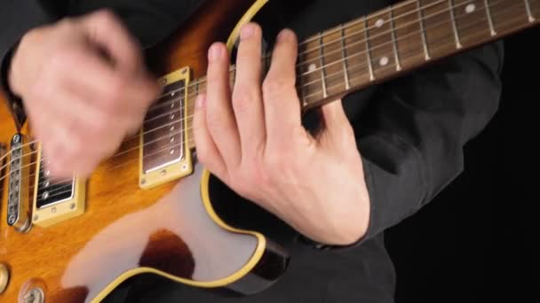 Guitarist Plays Light Brown Six String Electric Guitar Pick Black — Stock Video