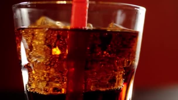 Hand Stirs Ice Cubes Cola Using Red Straw Ice Floats — Stock Video