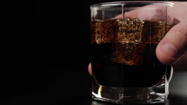 Hand Puts Glass Tasty Cola Bubbles Ice Cubes Black Table — Stock Video