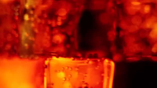 Ice Cubes Float Spin Bubbles Glass Cola Brown Highlights Black — Stock Video