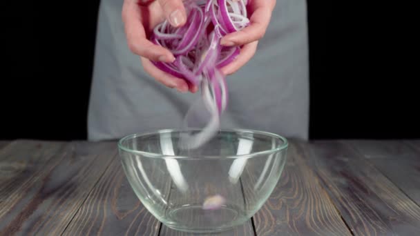 Professional Chef Pours Sliced Purple Onion Empty Glass Bowl Wooden — Stock Video