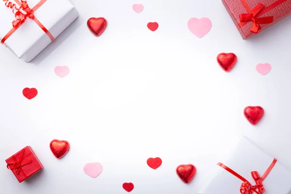 Valentine's Day background.  with gifts and hearts, in red and white, top view. San valentin and love concept. — Stock Photo, Image