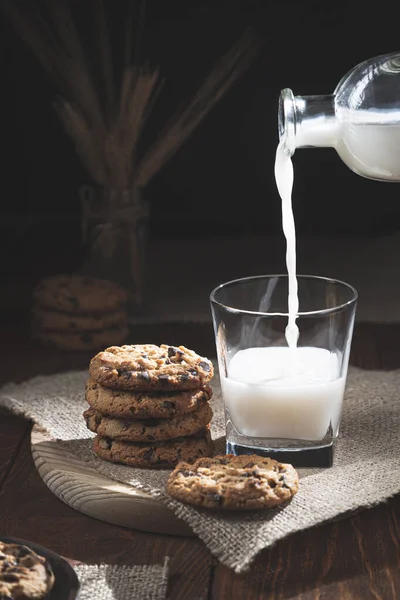 Chocolate Chip Cookies Milk Bottle Spilling Milk Glass Wooden Base — Stock Photo, Image