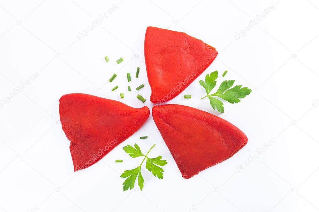 Roasted piquillo peppers with parsley and chivesisolated on  white background. Top view.