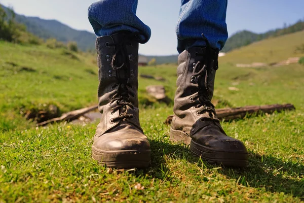 Close up view of feet with army boots outdoor