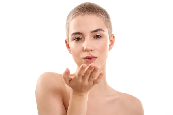 Kiss for you. Young half naked blond woman with short hair sending an air kiss while standing against white background — Stock Photo, Image