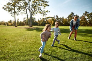 Building strong bodies and minds. Excited family having fun outdoors on a sunny day