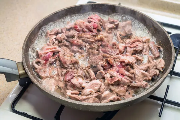 Meat roasted on frying pan — Stock Photo, Image