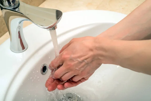 Washing hands at kitchen — Stock Photo, Image