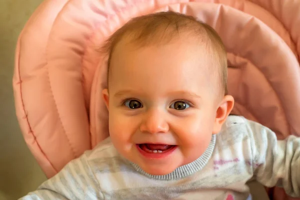 Happy baby while being feeded — Stock Photo, Image