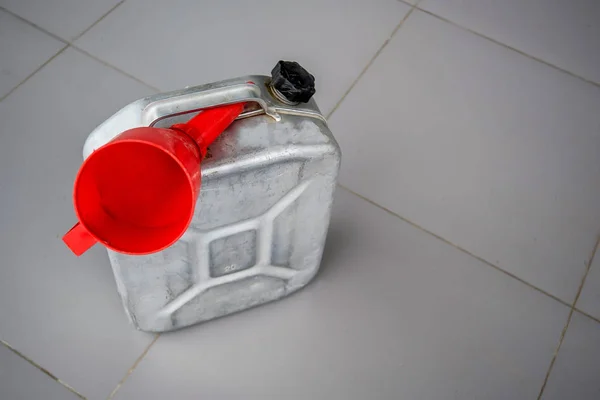 Gasoline canister with red funnel — Stock Photo, Image