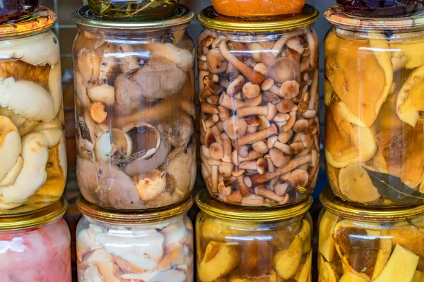 Pickled spicy mushrooms at village marketplace — Stock Photo, Image