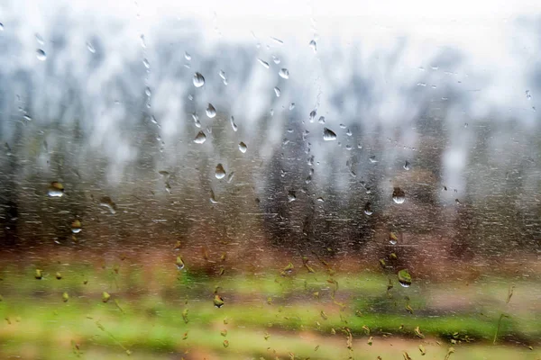 Raindrops on train window traveling concept