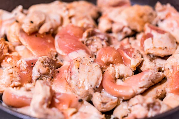Close up chicken fillet on frying pan — Stock Photo, Image