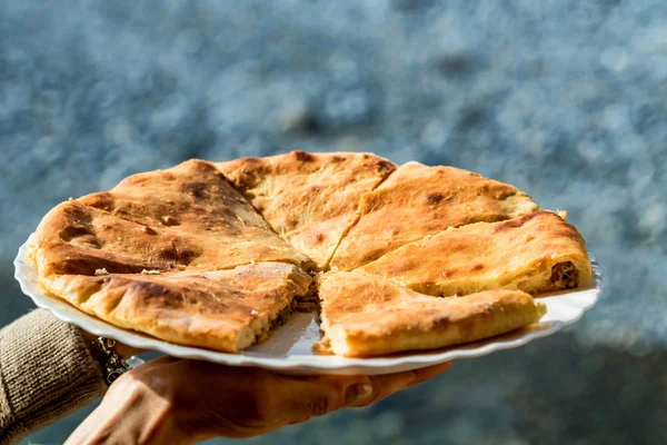 Caucasian khychin bread pie with meat close — Stock Photo, Image