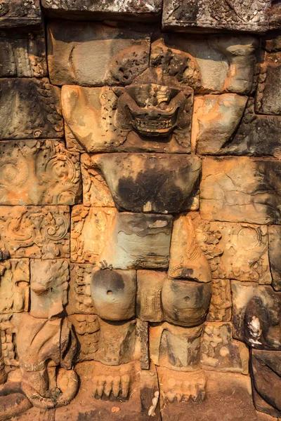 Yaksha demon image in stone wall in Cambodia — Stock Photo, Image