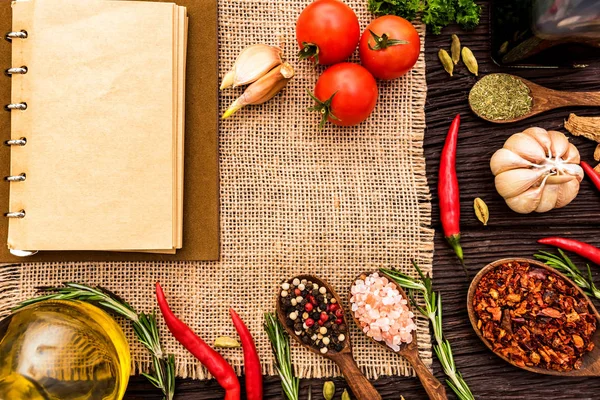 Open cook book and various spices composition — Stock Photo, Image