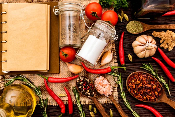 Open cook book and various spices composition — Stock Photo, Image