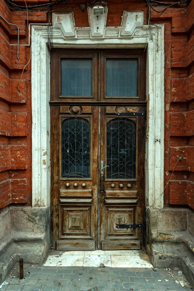 Old vintage wooden door with glass and metal parts — Stock Photo, Image