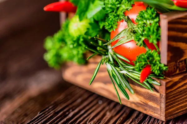 Fresh vegetables and herbs in wooden box — Stock Photo, Image