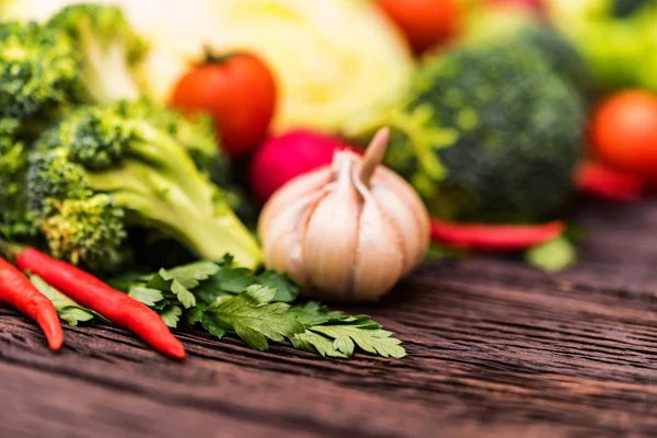 Fresh seasonal vegetables on wooden surface — Stock Photo, Image