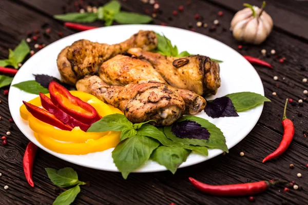 Roasted chicken quarter legs on rustic background — Stock Photo, Image