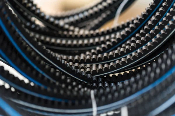 Closeup old timing belts. Rubber spare parts — Stock Photo, Image