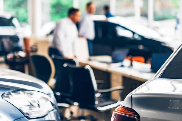 New cars at dealer showroom blurred background — Stock Photo, Image