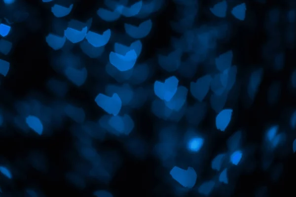 Luzes desfocadas na forma de corações . — Fotografia de Stock