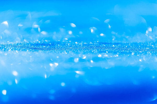 Christmas background of blue snow with bokeh effect, perfect for writing
