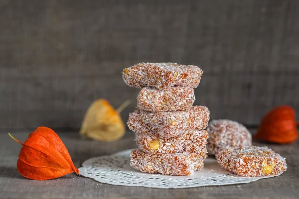 Homemade orange fruit candy in coconut flakes — Stock Photo, Image